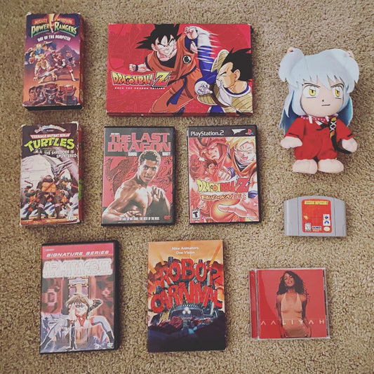 Picture of several red items including retro anime like Dragon Ball Z, Inuyasha, Robot Carnival, Armitage III, and 90s shows and cartoons like Teenage Mutant Ninja Turtles and Power Rangers