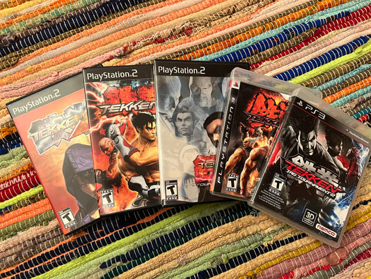 Tekken Playstation and Playstation 3 Games laying on a rug